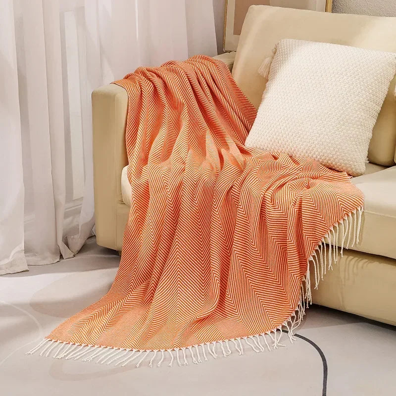 Cotton sofa throw with striped pattern and fringes