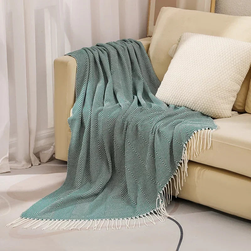 Cotton sofa throw with striped pattern and fringes