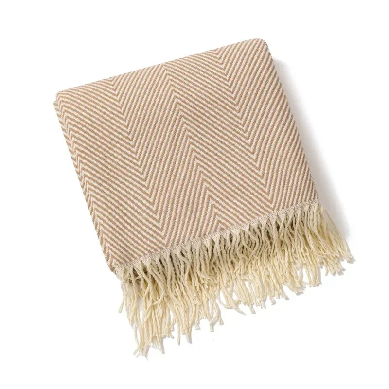Cotton sofa throw with striped pattern and fringes