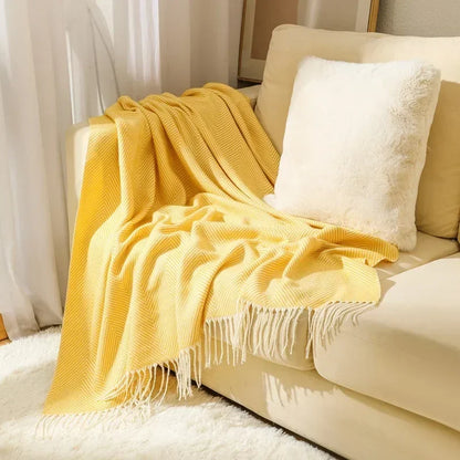 Cotton sofa throw with striped pattern and fringes