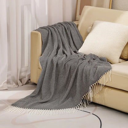Cotton sofa throw with striped pattern and fringes