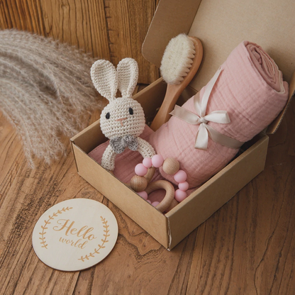 Baby gift box with muslin blanket and crocheted toy