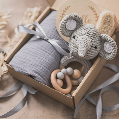 Baby gift box with muslin blanket and crocheted toy